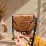 کیف چرم زنانه | شفق قهوه ای گرم ابر و بادی سنگی | چرم اصل گاوی